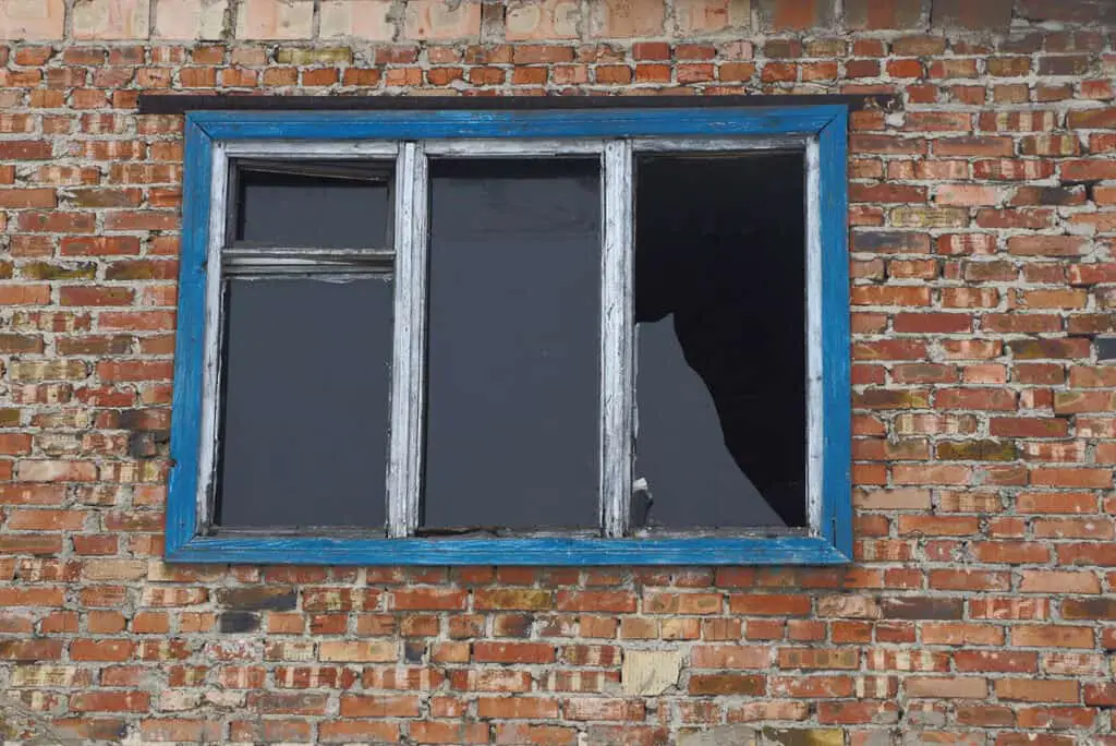 old window with broken glass pane