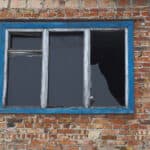 old window with broken glass pane