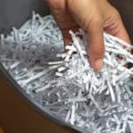 shredded paper in shredder basket