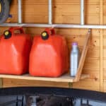 petrol cans on shelf in garage